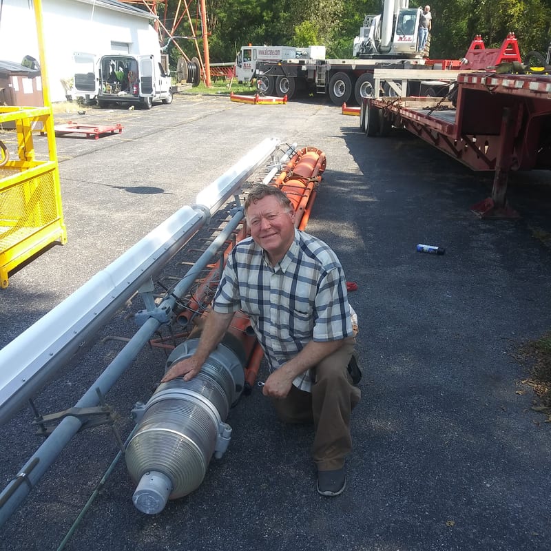 COACB founder David R. Aiken with the old tower beacon light, when the tower was converted to a dual-mode red & white LED beacon
